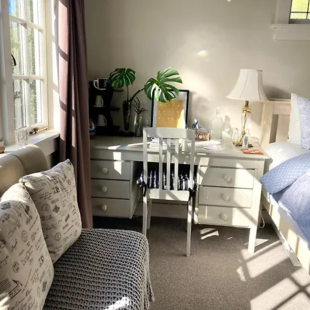 Spacious And Sunny Master Bedroom With Shared Bathrooms